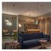 LYRIC Hotel Paris Opera lounge with navy sofa, pendant lights, bar and seating in Paris