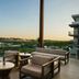 AC Hotels by Marriott Tallahassee Universities at the Capitol terrace with lounge seating and sunset view