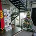 Hotel Flagman in Bishkek lobby with staircase, brochure stand, Kyrgyz flag and decorated Christmas tree