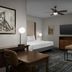 Homewood Suites by Hilton Lynnwood Seattle Everett WA suite with bed, sofa, desk and TV in Lynnwood