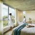 Hotel Entre Cielos in Luján de Cuyo: spa suite with large windows, bathtub, and scenic vineyard view