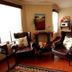 Oak Rest Guesthouse, Kimberley lounge with leather armchairs, fireplace and artwork