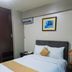 Hotel La Joya in Huaraz: single bed, air conditioning, wardrobe, and framed wall art in a compact room.