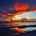 Carousel Suites -Redington Shores beach sunset with pier reflections over calm water