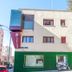 AYZ Javier Cabrini in Madrid, auto check-in hotel exterior with green ground floor and blue balcony