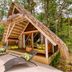 Shawandha Ecolodge in Puerto Viejo de Talamanca, A-frame bungalow with lounge chairs in lush tropical forest