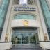 Siji Hotel Apartments in Fujairah, exterior entrance with tall tower façades and glass doors
