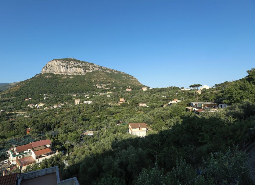 Hotel Royal Hills, Piano di Sorrento, with hillside and mountain views under a clear blue sky