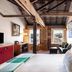 The Henry Jones Art Hotel Hobart room with harbor view and exposed beams