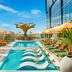 AC Hotels by Marriott Los Downtown Los Angeles rooftop pool with lounge chairs and city views in Los Angeles