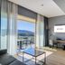 mk hotel tirana in Tirana room with balcony, mountain view, desk and seating area