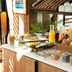Breakfast buffet at Hotel Eiffel Turenne in Paris with pastries, fruit, cereal and orange juice