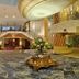 Grand Hotel La Pace in Sorrento lobby with ornate chandelier, marble floor and floral centerpiece