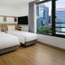 Moxy Seoul Insadong guest room with two twin beds and large city-view window in Seoul