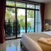 Radateeree Boutique Resort in Chiang Mai guest room with balcony and pool view