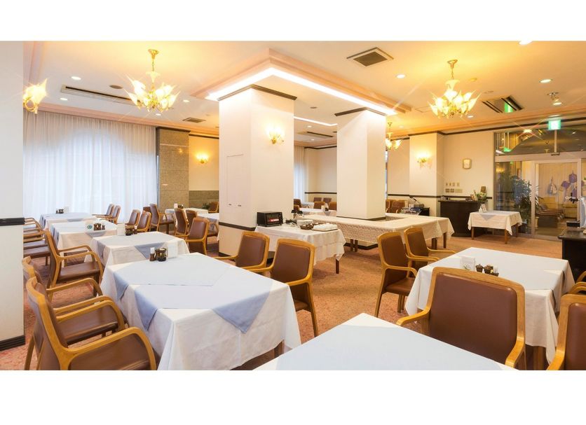 Abashiri Royal Hotel in Abashiri dining room with set tables and chairs
