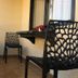 Katero in Pokhara balcony with black chairs and a small wall-mounted table