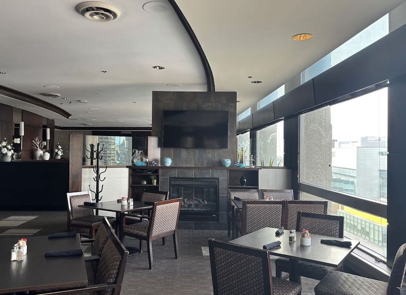Radisson Hotel Winnipeg Downtown lounge with fireplace and large windows in Winnipeg