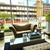 Ramada Plaza Panama Punta Pacifica lobby seating area with tufted chairs, sofa, coffee table and street view