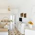 Ostuni a Mare in Ostuni, bright white lounge with beige seating, TV, and tiled floor leading to a doorway