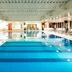 Mercure Manchester Norton Grange Hotel & Spa indoor pool in Rochdale with lounge chairs
