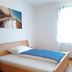 Gästehaus Klug bedroom in Sankt Stefan ob Stainz with a single bed and bright window light.