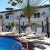 Hotel Paraiso Kora in San Blas with a poolside terrace, lounge chairs, and palm trees