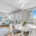 Pinnacle Port A-305 in Panama City Beach dining area with sliding glass door and coastal view