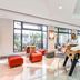 Novotel Paris Pont de Sevres lobby with foosball table and seating near large windows in Sèvres