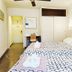 La Caleta de Tamariu guest room in Tamariu with twin beds, desk, wardrobe and ceiling fan