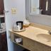 Briarwood Inn Sparta bathroom vanity with sink, mirror, and coffee setup