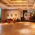 Tizi Hostel in Shanghai lobby with reception desk, seating area, and warm tiled floor