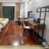 Jinjun Hotel (Chongqing North Railway Station) room with two beds, desk, and balcony view