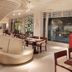 Century Palace Hotel Huiyang in Huizhou lobby restaurant with curved ceiling, tables, and booth seating