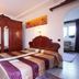 Pensión Landazuri in Granada: guest room with carved wood wardrobe and double bed