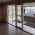 Denison Inn & Suites in Denison entrance with glass doors and covered exterior walkway