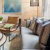 Hotel Mountain Brook in Tannersville: cozy lounge with sofa, armchair, floor lamp and abstract wall art