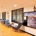Active Life Madarao lobby lounge with chairs, table, staircase and mountain poster in Iiyama