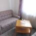Hotel Am Markt in Eckartsberga: small room with floral sofa beside a wooden coffee table and window