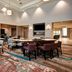 Homewood Suites by Hilton Salt Lake City Airport lobby with seating and tables in Salt Lake City