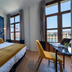 Puente Colgante Boutique Hotel in Portugalete room with twin beds and balcony view of the river