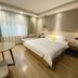 Dream 8 Business Hotel in Taizhou guest room with double bed, large window and modern lighting