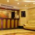 Hubin Bubugao Hotel in Qingyuan lobby with colorful front desk and beige sofa seating