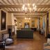 Parador de Jarandilla de la Vera lounge with chandelier, fireplace and classic seating in Jarandilla de la Vera