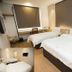 Extreme Boutique Hotel Kluang guest room with two double beds and wall-mounted TV