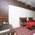 OYO 3201 Hotel Jhankar in Alwar lounge with red tables, patterned rug and wooden seating