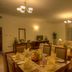 Siji Hotel Apartments in Fujairah living room with dining table, sofa seating and curtains