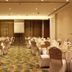 White Fort Hotel Dubai banquet hall with round tables and white chair covers