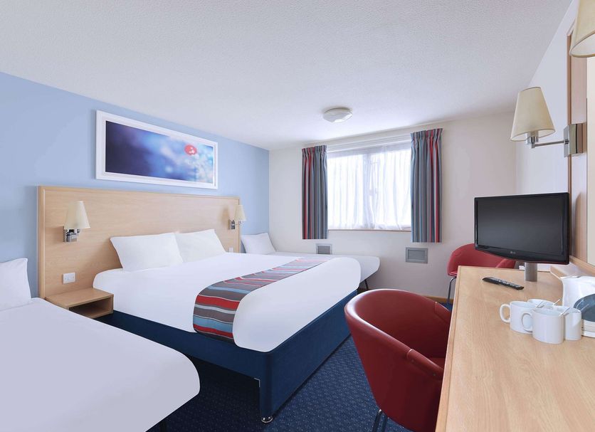 Travelodge Burton M6 Northbound in Carnforth guest room with two beds, TV, and desk