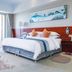 Haiqing Hotel, Qingdao: guest room with sea view balcony, king bed, desk and lounge chair